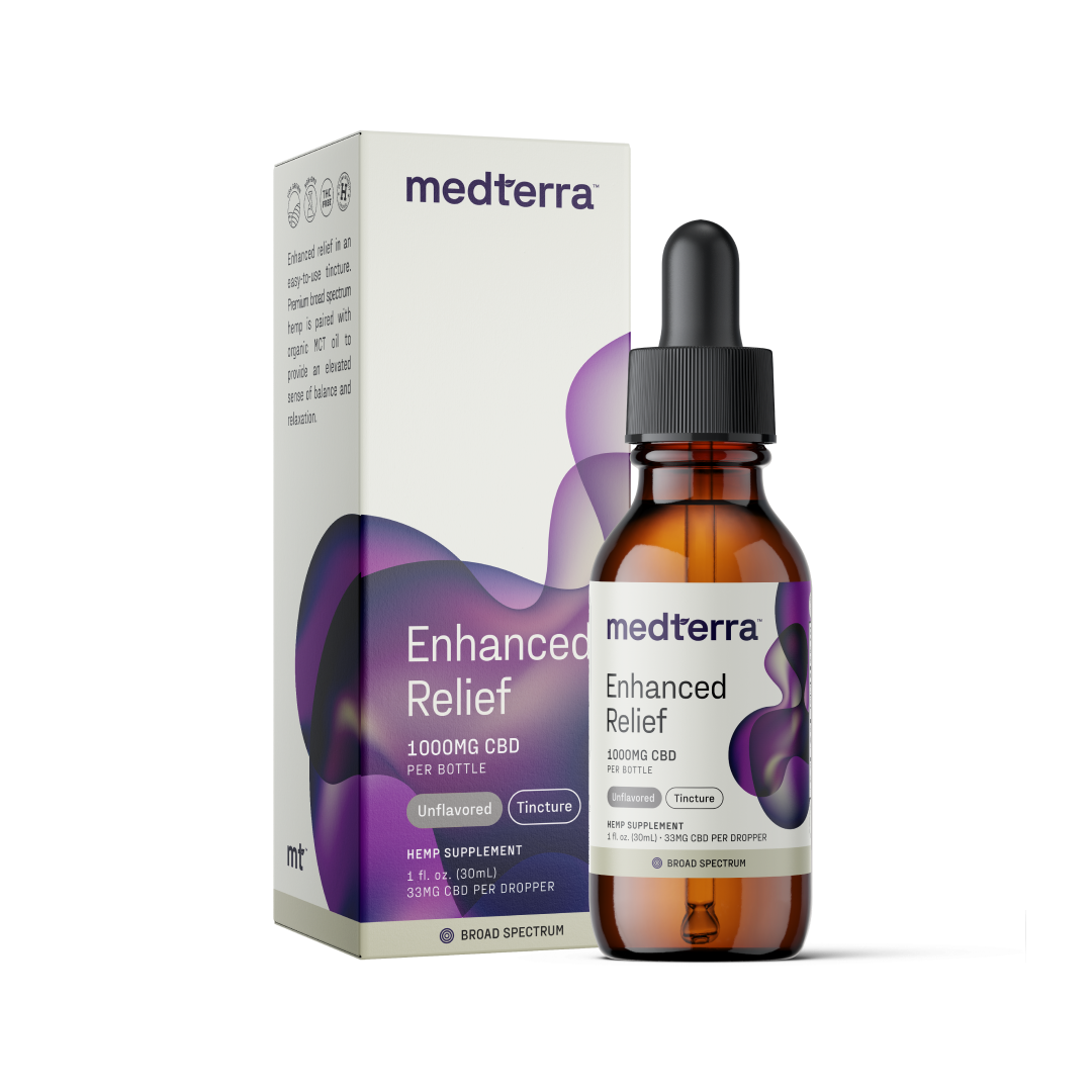 A bottle of Medterra Enhanced Relief Broad Spectrum CBD Oil in front of its box. The bottle displays "1000mg CBD," "Unflavored," and "Tincture." The packaging features a purple and gray design with product information, including "Broad Spectrum" for a comprehensive entourage effect and the text "33mg CBD per dropper.
