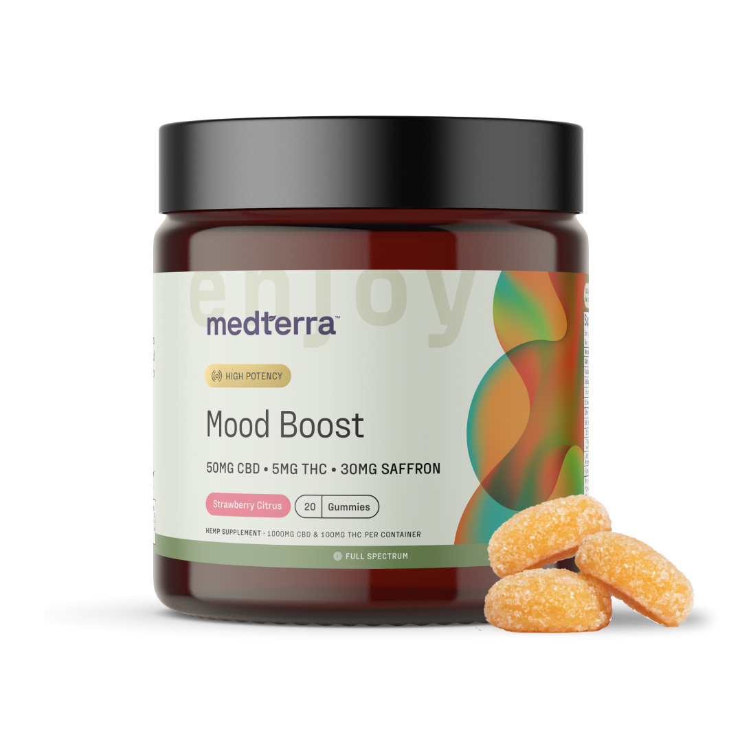 A brown jar with a black lid labeled "Medterra Mood Boost CBD Gummies" contains 20 strawberry citrus gummies, each containing 50mg of CBD, 5mg of THC, and 30mg of saffron. Three gummies are displayed outside the jar.