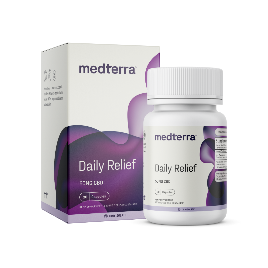 A white bottle and box of Medterra's Daily Relief CBD Isolate Capsules. The label indicates 30 capsules, each offering 50mg of CBD Isolate. The packaging features a purple and black design with white text, highlighting the use of organic MCT Coconut Oil for enhanced absorption.