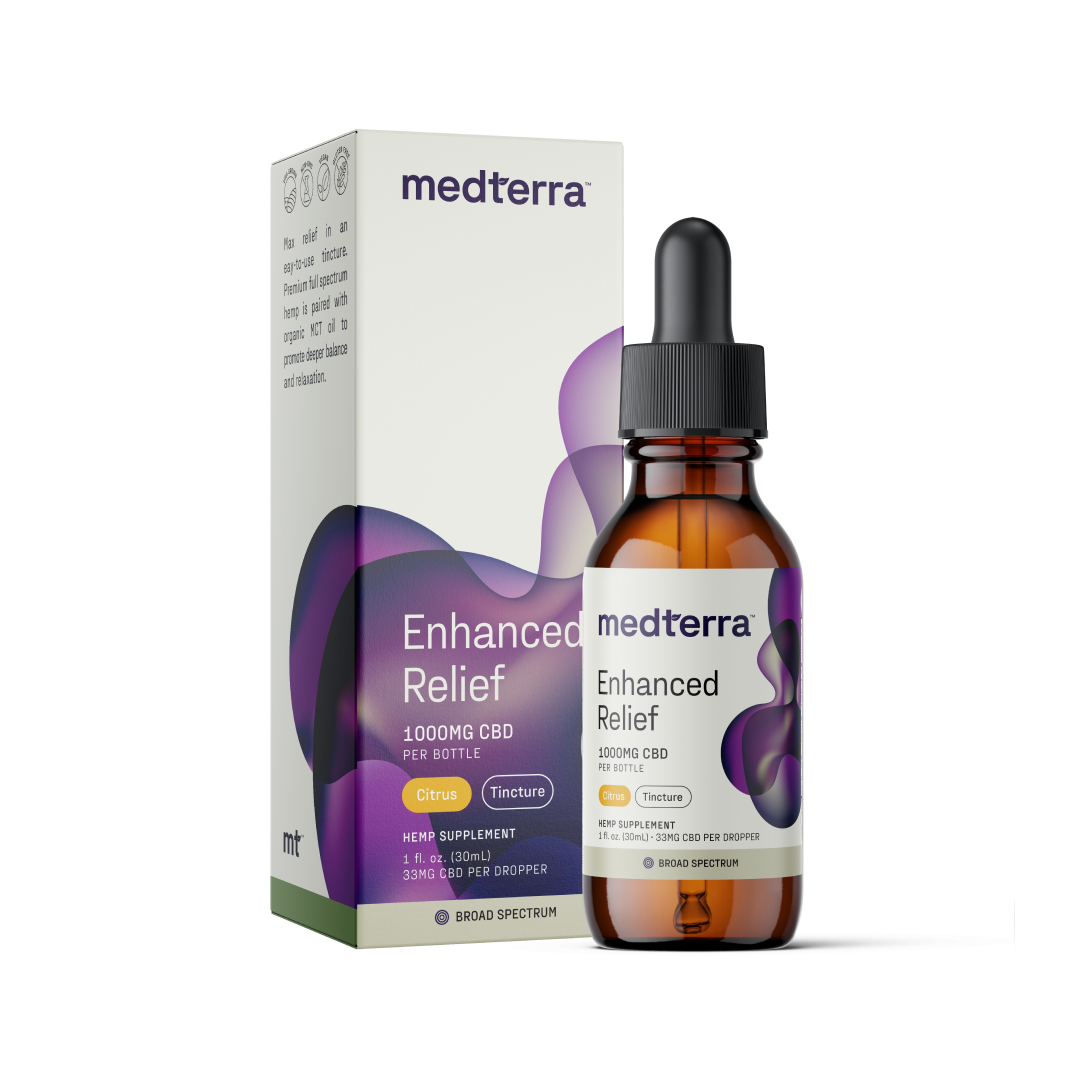 A box and bottle of Medterra's Enhanced Relief Broad Spectrum CBD Oil, containing 1000mg of Broad Spectrum CBD per bottle. The bottle includes a dropper and features a label indicating citrus flavor in tincture form. Both the packaging and the bottle label boast a modern design with purple waves and informational text, emphasizing the natural benefits of the hemp plant.
