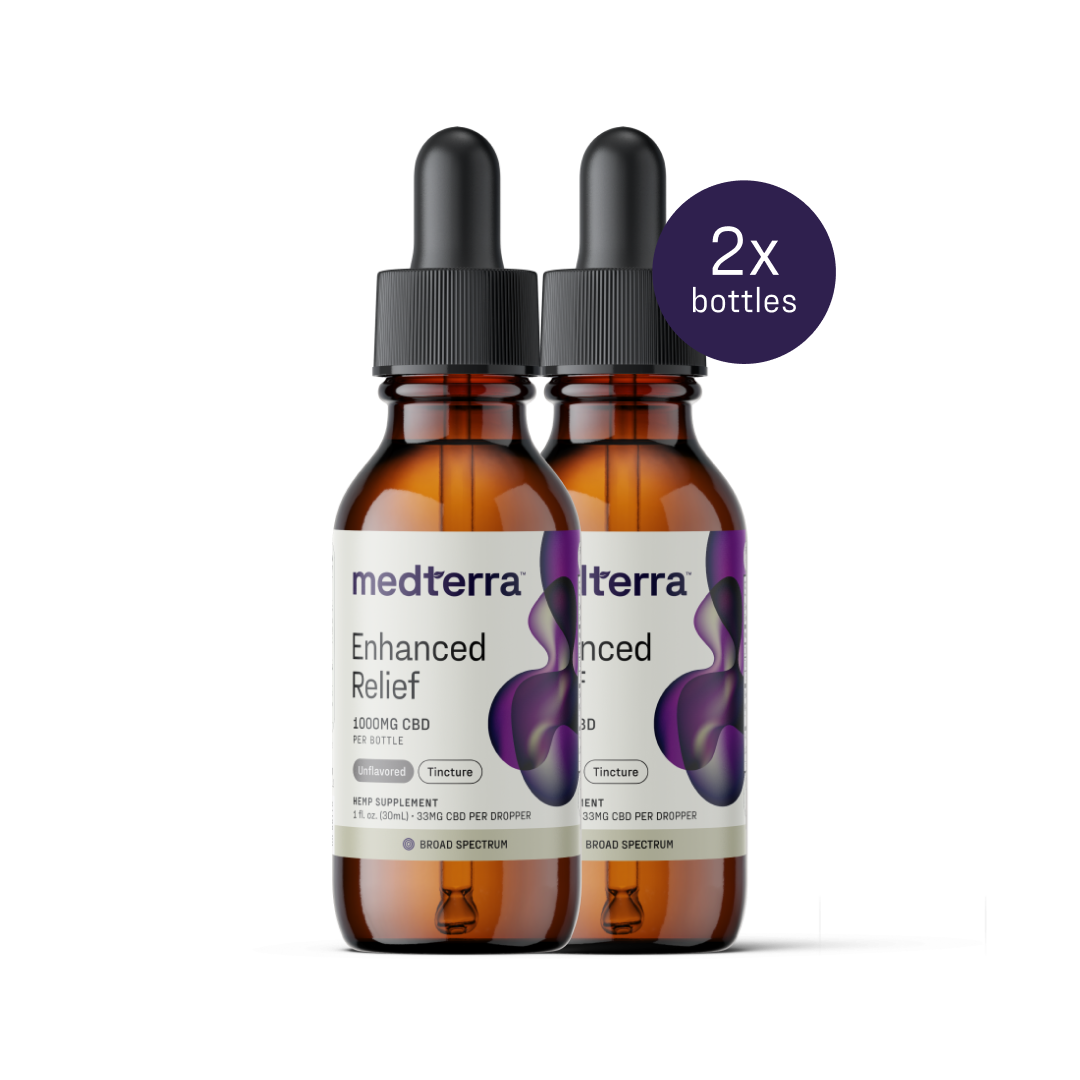 Two amber bottles with droppers, labeled “Medterra Enhanced Relief Broad Spectrum CBD Oil” and each containing 1000mg of CBD, are pictured side by side. A purple circle at the top right reads "2x bottles." The labels emphasize "Broad Spectrum," highlighting the benefits of the hemp plant's entourage effect. Dosage information is included.
